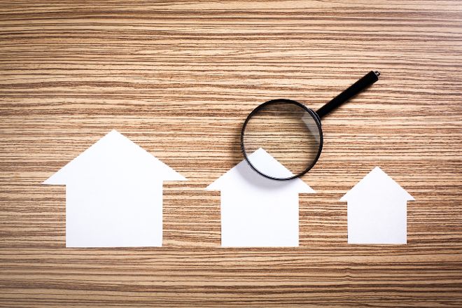 paper house with Magnifying Glass